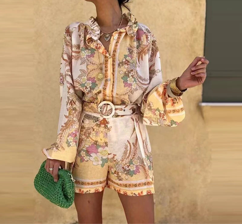 Model wearing floral print shorts set with button-up top and lantern sleeves