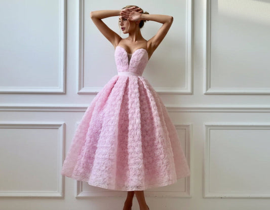 Blush pink strapless rosette tea-length dress - front view