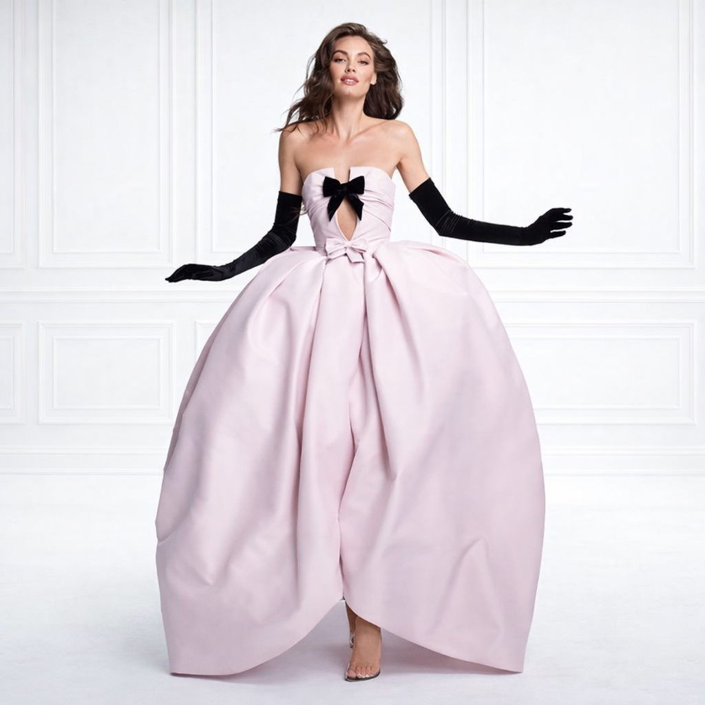  Full front view of pink ball gown with black velvet bow
