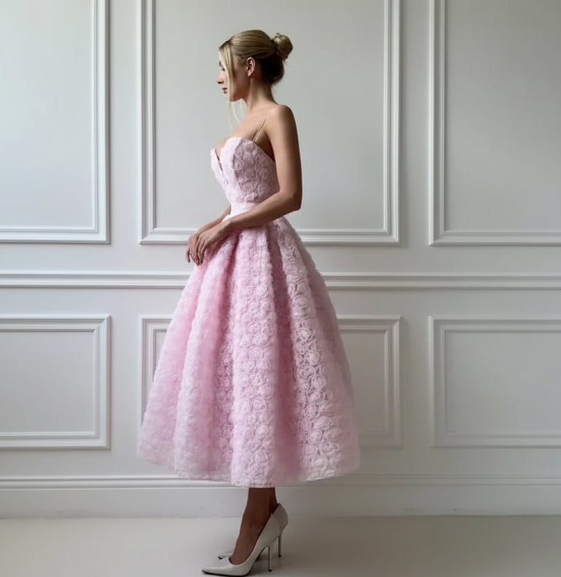 Blush pink strapless rosette tea-length dress - side view