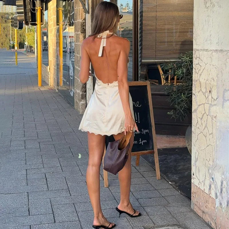 Back view of apricot lace halter mini dress