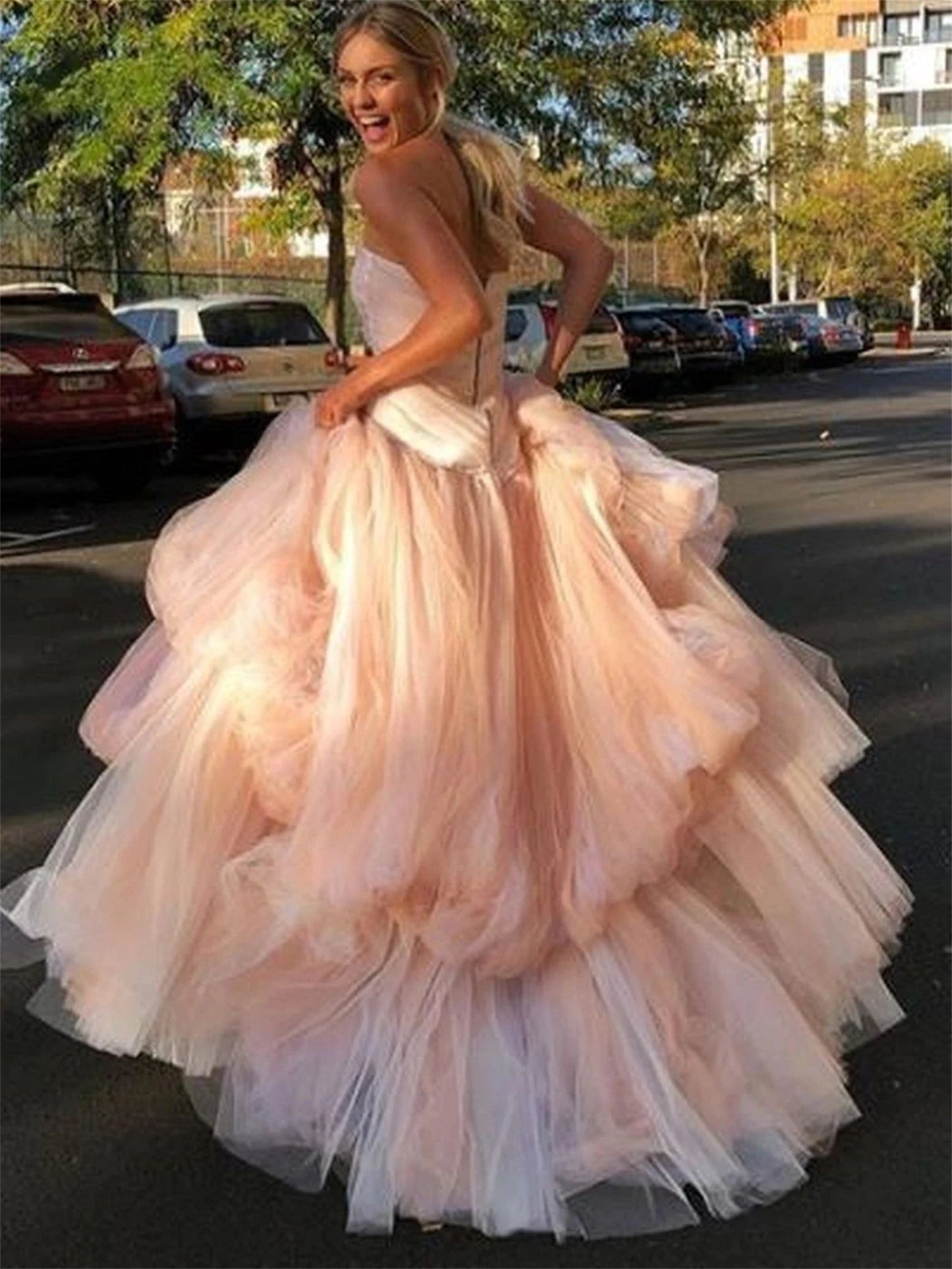 Back view of tulle tiered evening gown showing elegant silhouette