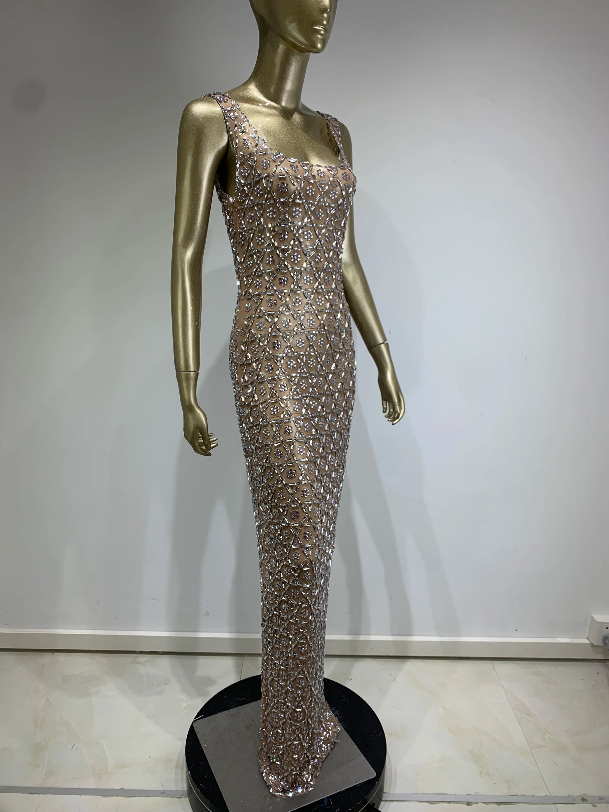 Side profile of crystal maxi dress showing floor-length and natural waistline
