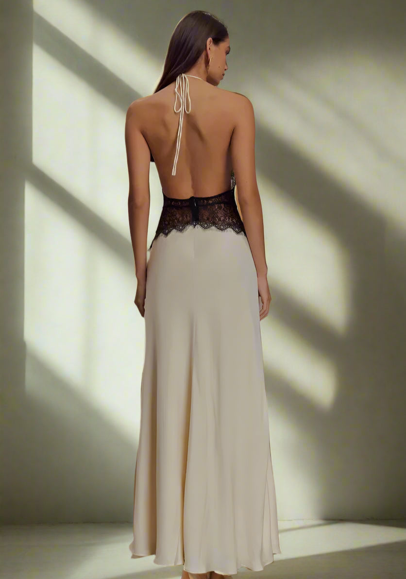 Back view of lace halter maxi dress showcasing stunning backless design