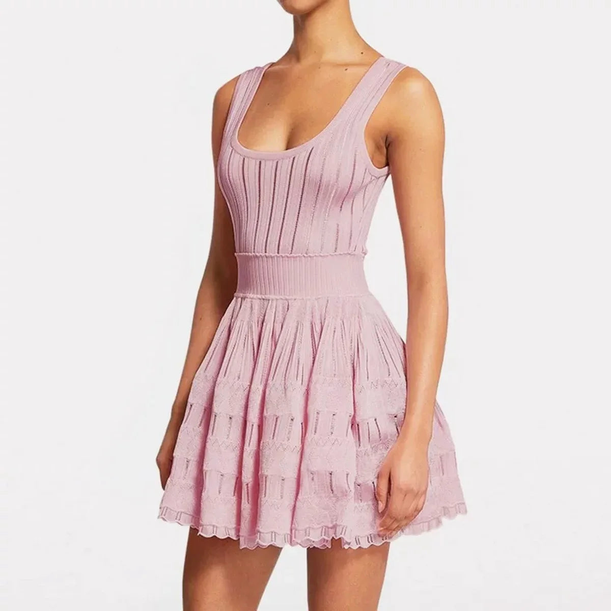 Model wearing fit and flare knit pink mini dress