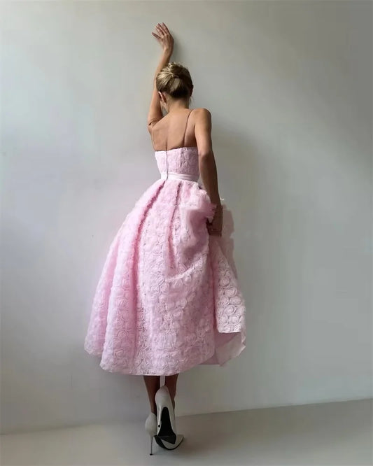Back view of blush pink rosette dress showing concealed zipper closure