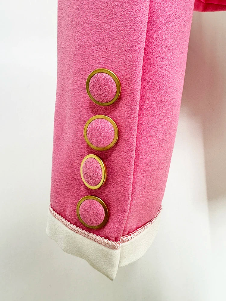 Close-up of button details on women's pink blazer suit jacket