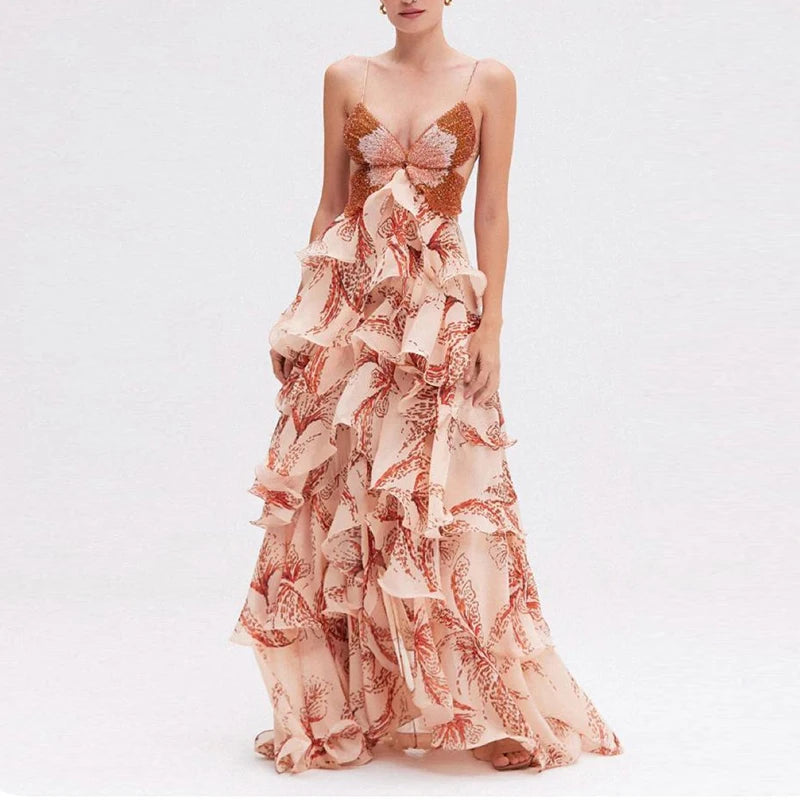 Model wearing flowing maxi dress with butterfly pattern