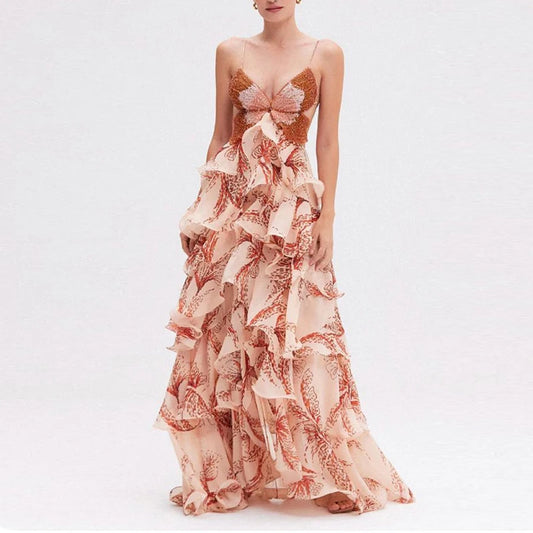 Model wearing flowing maxi dress with butterfly pattern