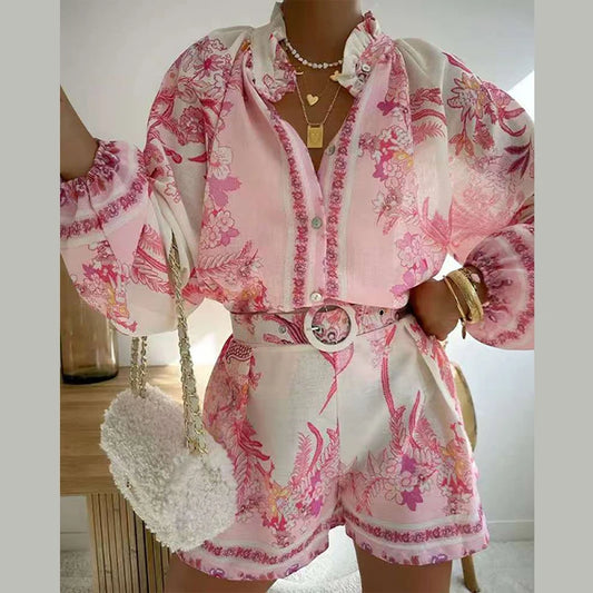 Model wearing floral print shorts set with button-up top and lantern sleeves